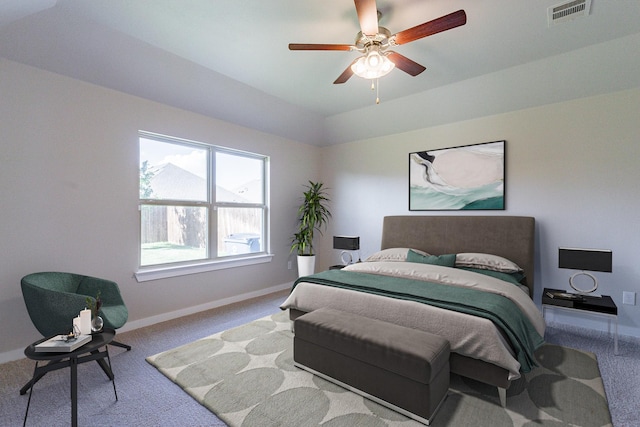 carpeted bedroom with ceiling fan and lofted ceiling