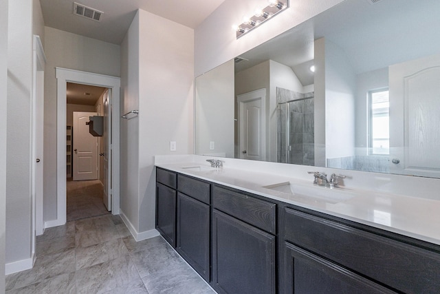 bathroom featuring walk in shower and vanity