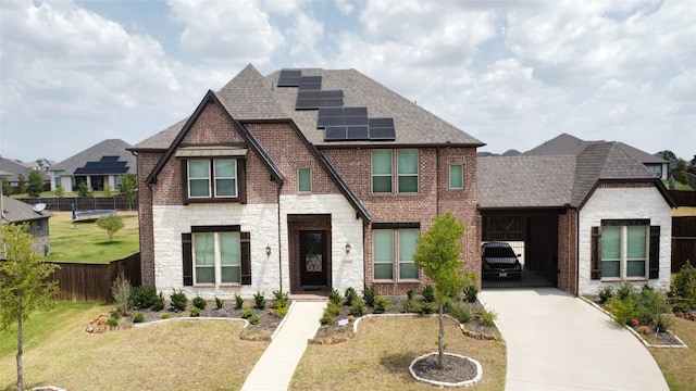 view of front facade featuring a front lawn and solar panels