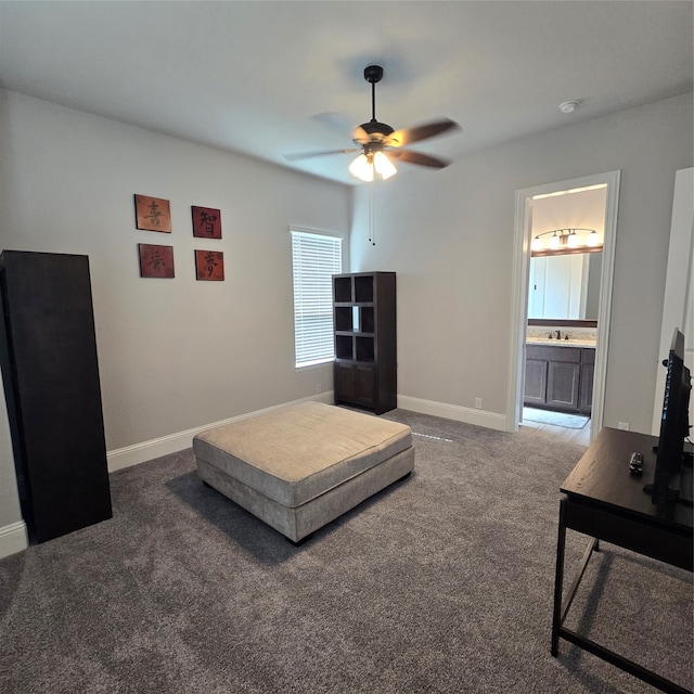 living room featuring carpet flooring, sink, and ceiling fan