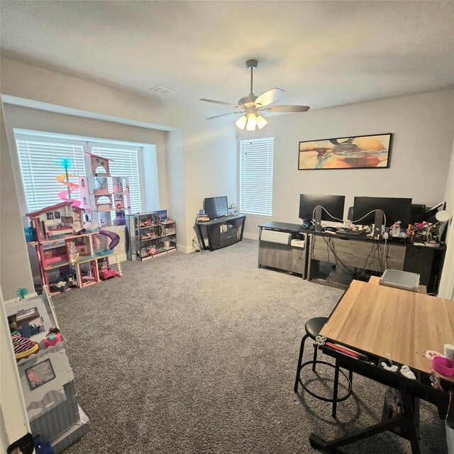 carpeted living room with ceiling fan