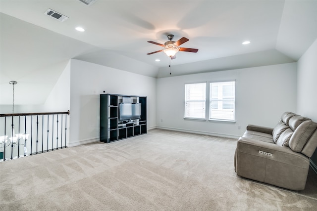 carpeted living room featuring lofted ceiling and ceiling fan