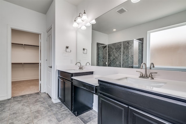 bathroom with vanity and an enclosed shower