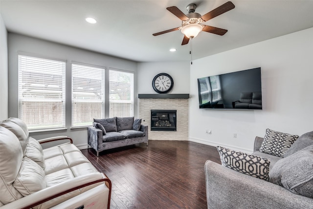 living room with ceiling fan and wood-type flooring