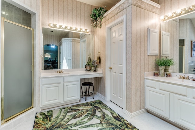 bathroom with tile patterned floors, walk in shower, and vanity