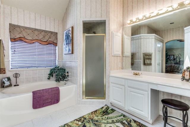 bathroom with plus walk in shower, vanity, and tile patterned floors