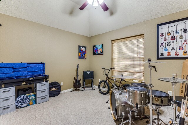 miscellaneous room with ceiling fan, a textured ceiling, and carpet floors