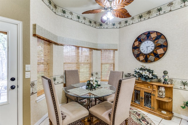 tiled dining area with ceiling fan