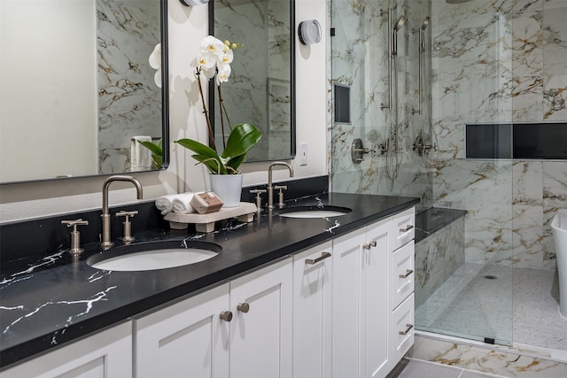 bathroom featuring dual vanity, tile patterned floors, and an enclosed shower