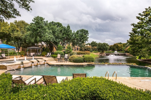 view of pool with pool water feature