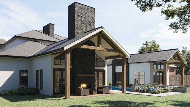 rear view of property with a yard, a patio, a fenced in pool, and an outdoor stone fireplace