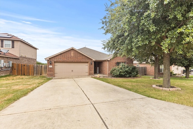 view of front of home with a garage and a front yard