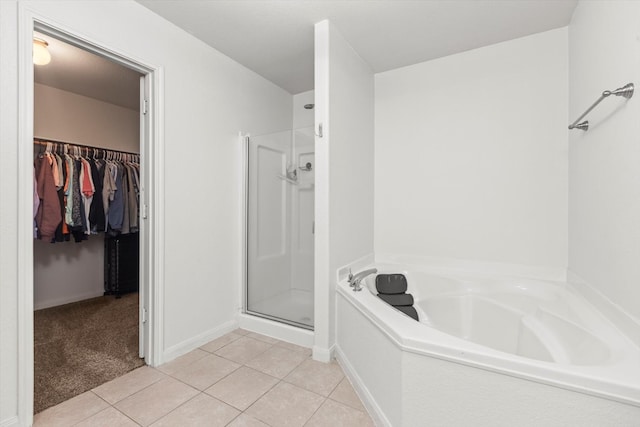 bathroom with tile patterned flooring and plus walk in shower