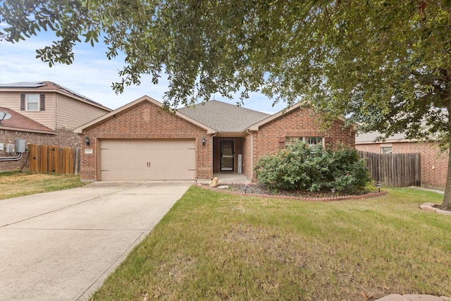 view of front of property with a garage and a front lawn