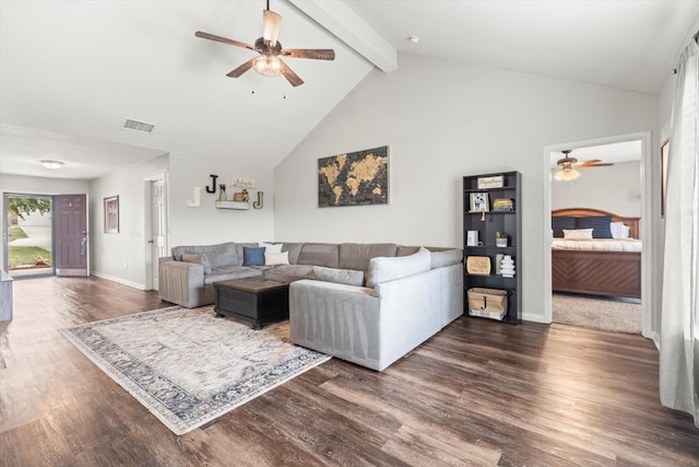 carpeted living room with high vaulted ceiling, ceiling fan, and beam ceiling