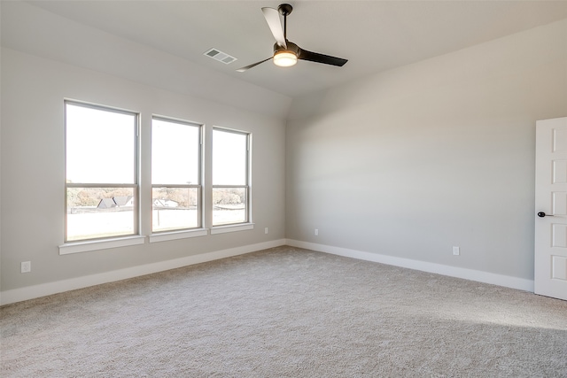 carpeted spare room with ceiling fan