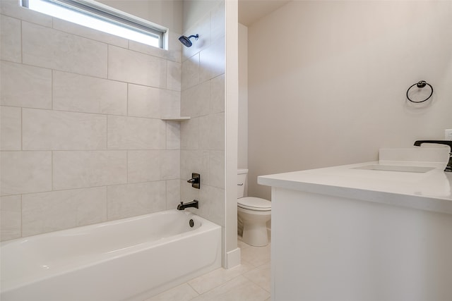 full bathroom featuring tile patterned flooring, tiled shower / bath combo, toilet, and vanity