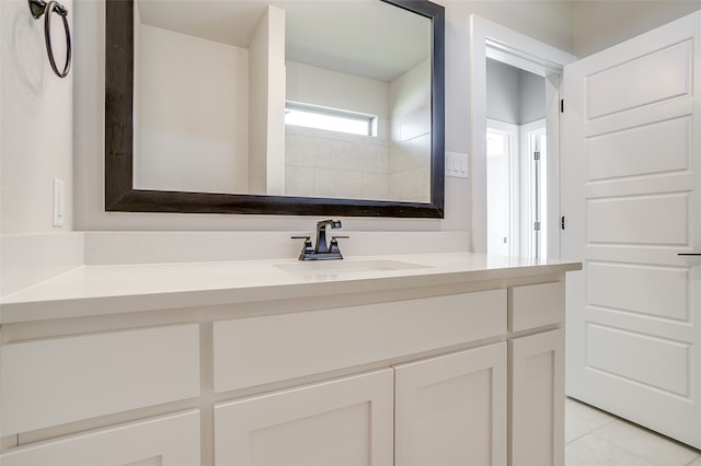 bathroom featuring tile patterned floors and vanity