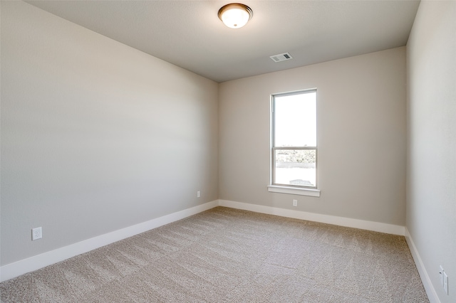 spare room featuring carpet flooring