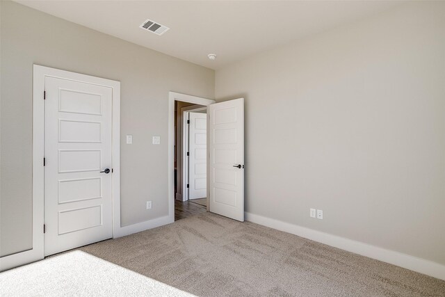 unfurnished bedroom with carpet