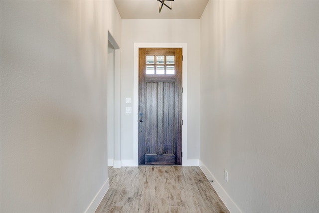 doorway with light hardwood / wood-style floors