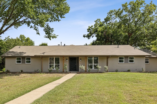 ranch-style home with a front lawn