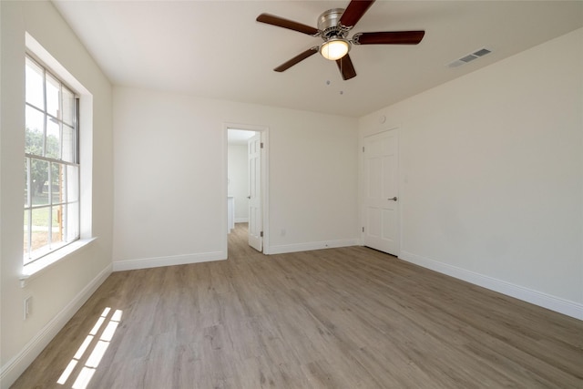 unfurnished room with light hardwood / wood-style floors and ceiling fan