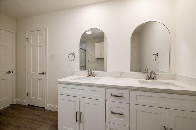 bathroom featuring wood-type flooring and vanity