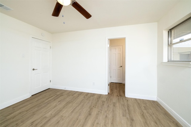 unfurnished room with ceiling fan and light hardwood / wood-style floors