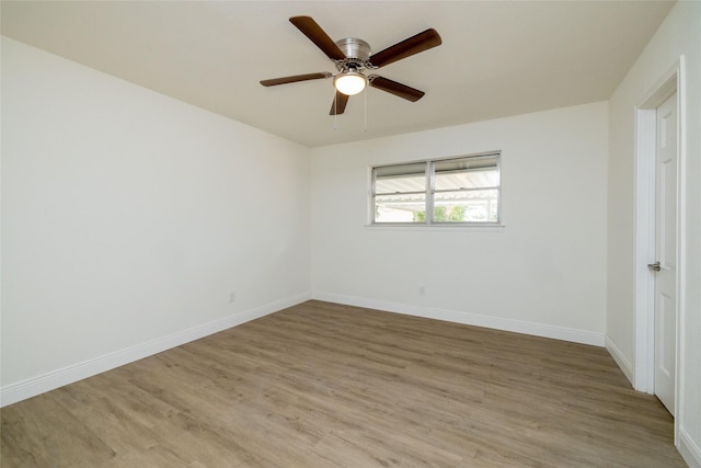 unfurnished room with ceiling fan and light wood-type flooring