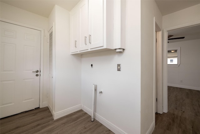 washroom featuring cabinets, electric dryer hookup, and dark hardwood / wood-style floors