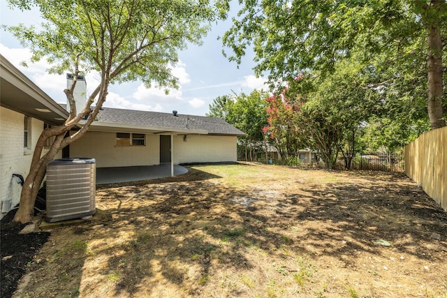 view of yard with a patio and central AC