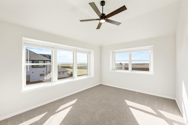 unfurnished room with carpet and ceiling fan