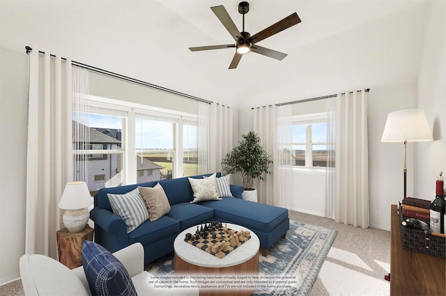 carpeted living room with a wealth of natural light and ceiling fan