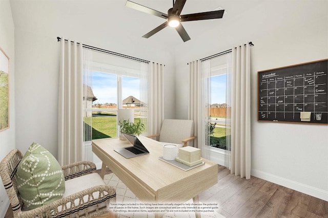 living area with plenty of natural light, ceiling fan, and light wood-type flooring