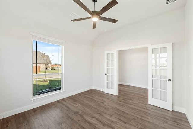 unfurnished room featuring ceiling fan, lofted ceiling, dark wood-type flooring, and french doors