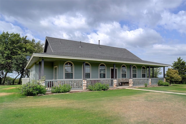 view of front of property with covered porch and a front lawn