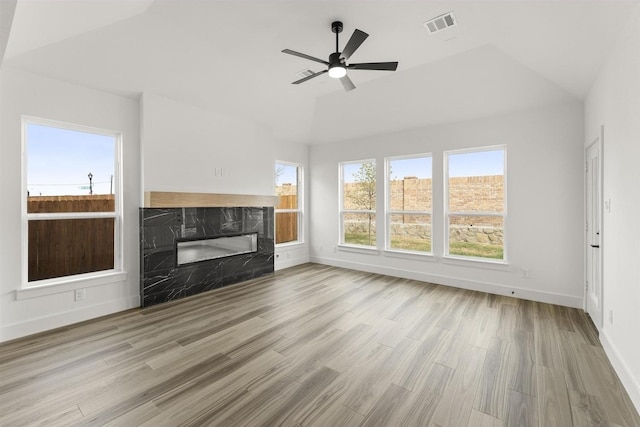 3104 Summer Rain Ln, Anna, TX 75409 - unfurnished living room featuring a fireplace, wood finished floors, ceiling fan, and lofted ceiling