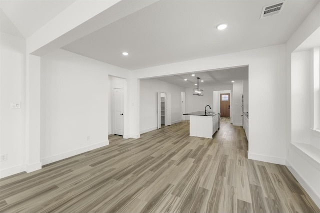 3104 Summer Rain Ln, Anna, TX 75409 - unfurnished living room featuring light wood-type flooring and recessed lighting