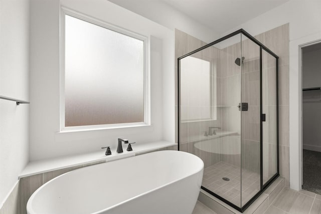 3104 Summer Rain Ln, Anna, TX 75409 - bathroom featuring a soaking tub, a shower stall, and tile patterned flooring