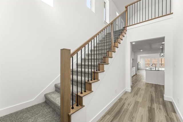 3104 Summer Rain Ln, Anna, TX 75409 - stairs with wood finished floors and a high ceiling