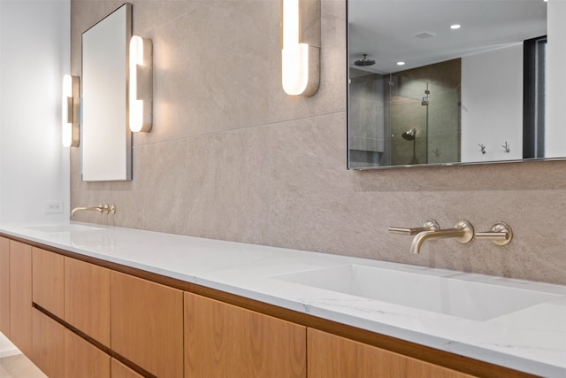 bathroom featuring vanity and walk in shower