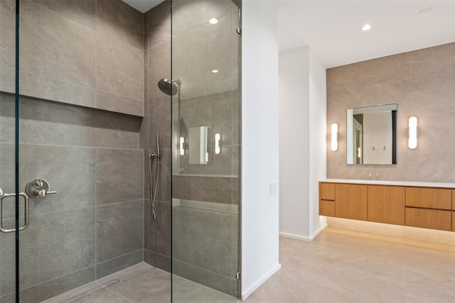 bathroom with an enclosed shower and vanity