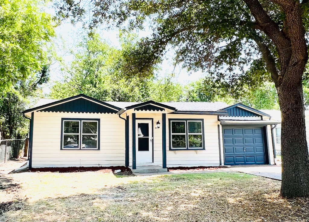 ranch-style home with a garage