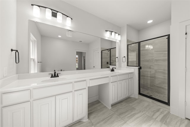 bathroom with vanity and an enclosed shower