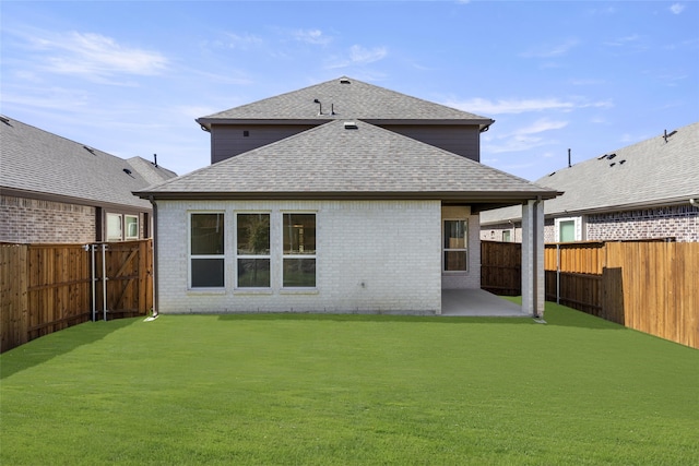 back of property featuring a yard and a patio area