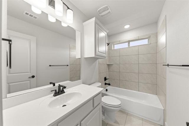 full bathroom with tile patterned flooring, vanity, toilet, and tiled shower / bath