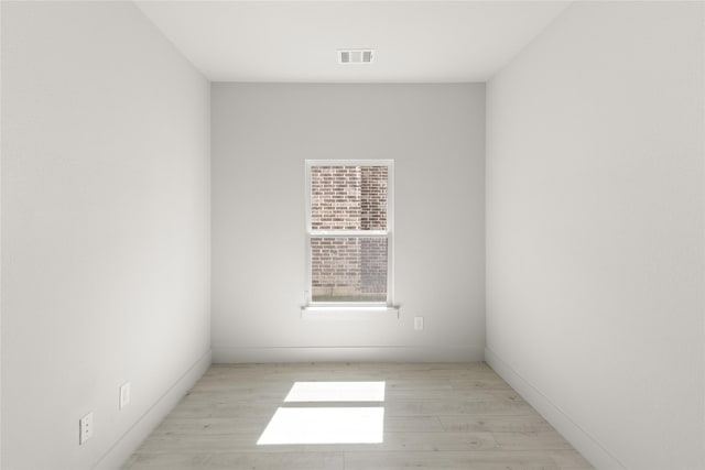 spare room with light hardwood / wood-style floors