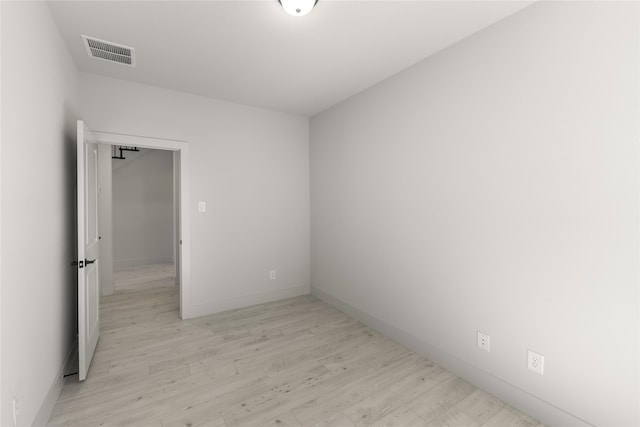 unfurnished room with light hardwood / wood-style flooring