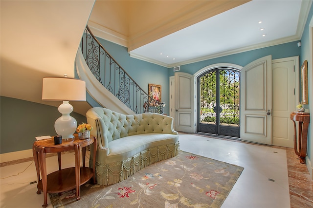 entryway featuring french doors and ornamental molding